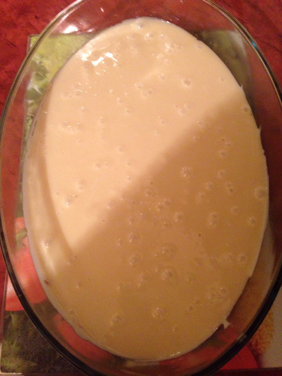 As it thickens pour immediately into the shortbread and spread evenly..