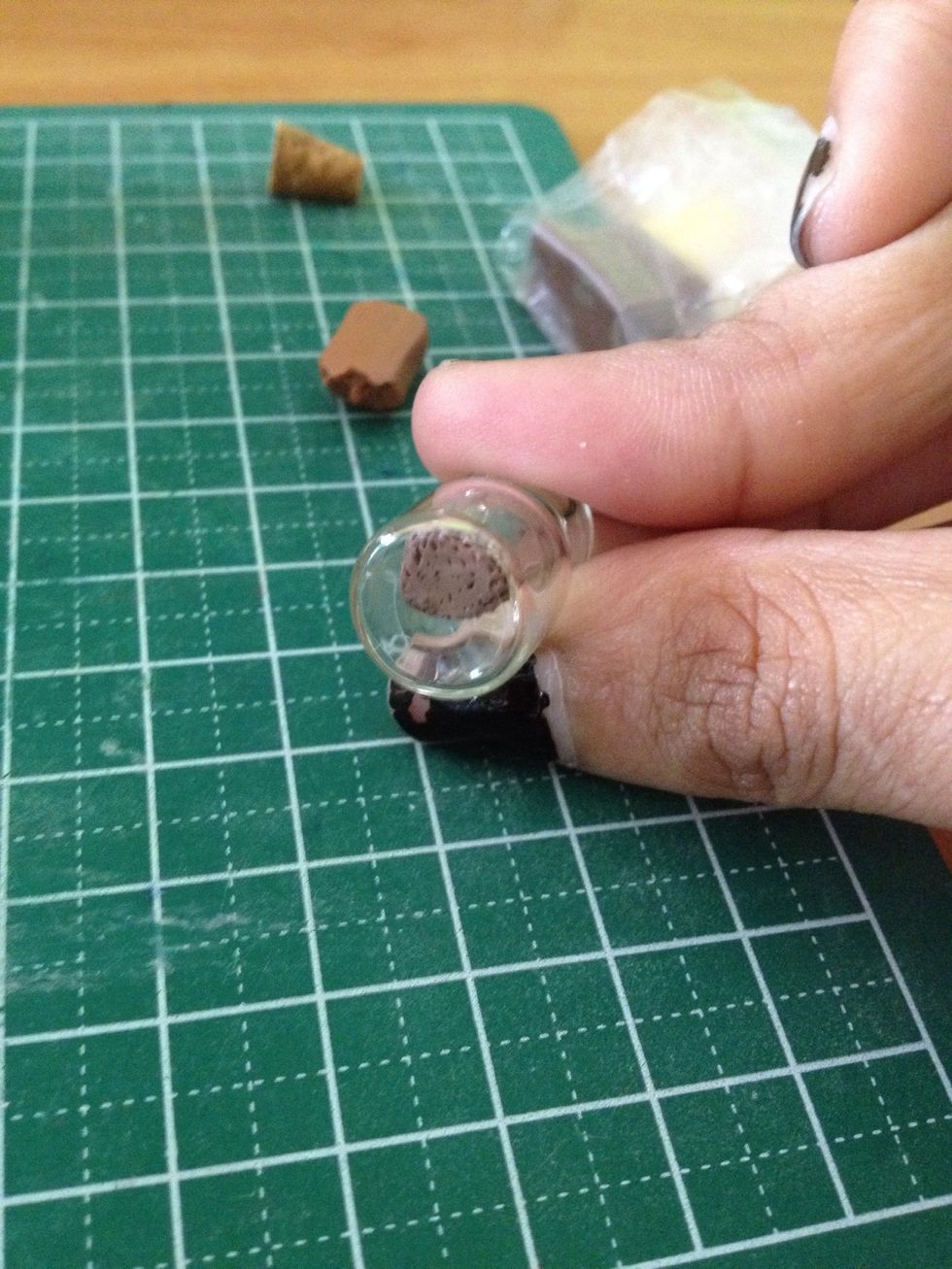 As seen from the bottom of the glass jar, the 'soil' has retained its texture.