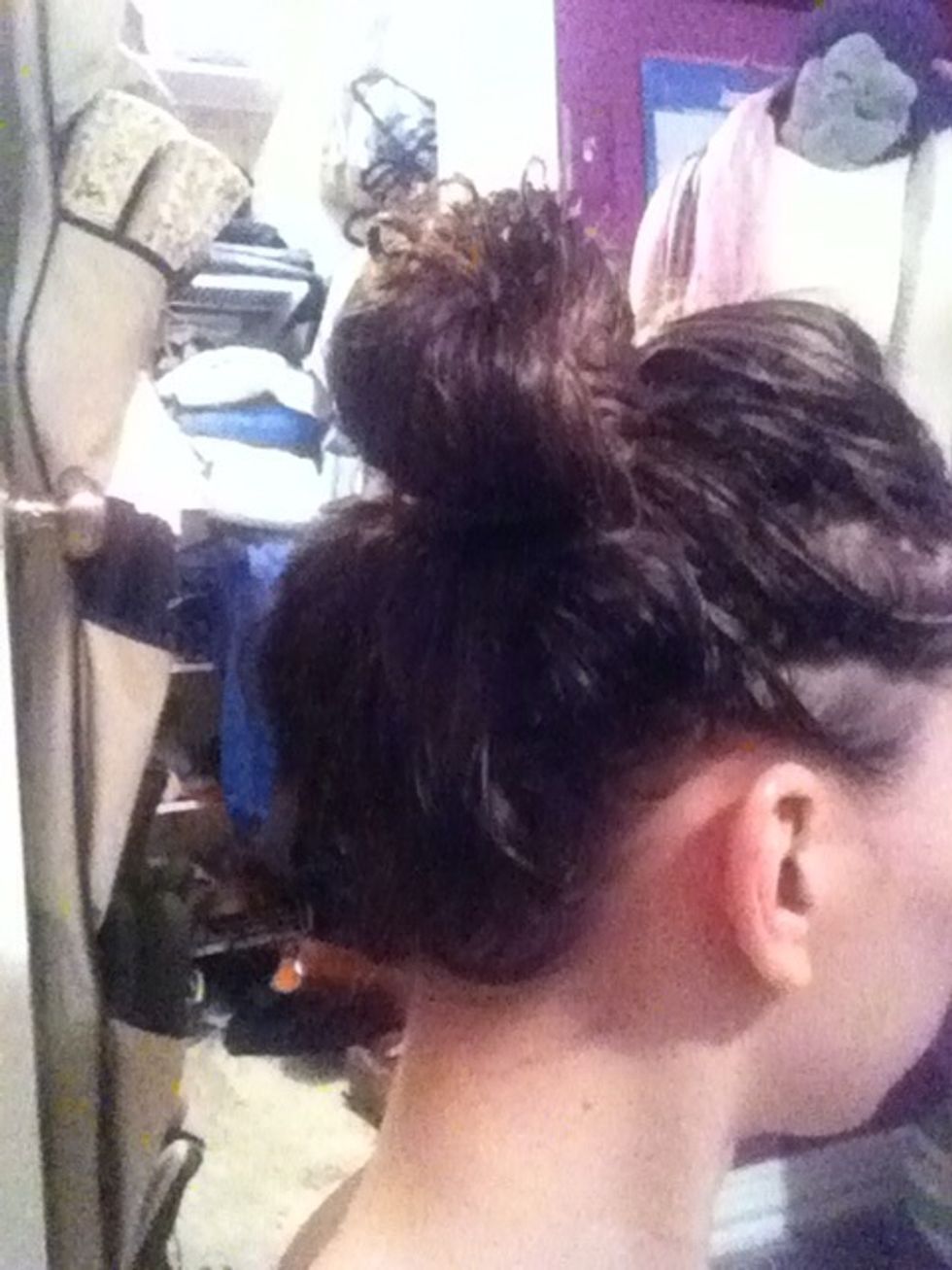 As soon as you get out of the shower whip your hair up into a high bun and let it stay there till it dries a little. (Doing homework, eating, watch a tv show, or any thing else will help take up time)
