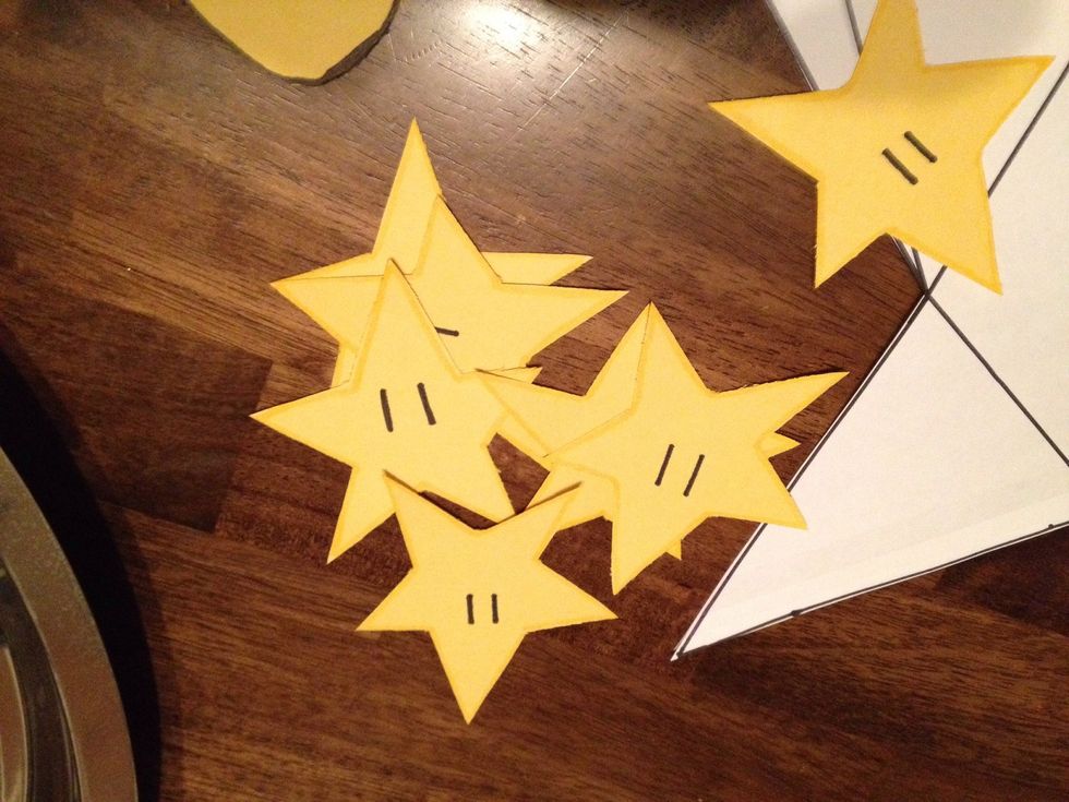 As table decorations, I cut yellow construction paper like stars and drew on eyes. I laid them on the table the day of the party.