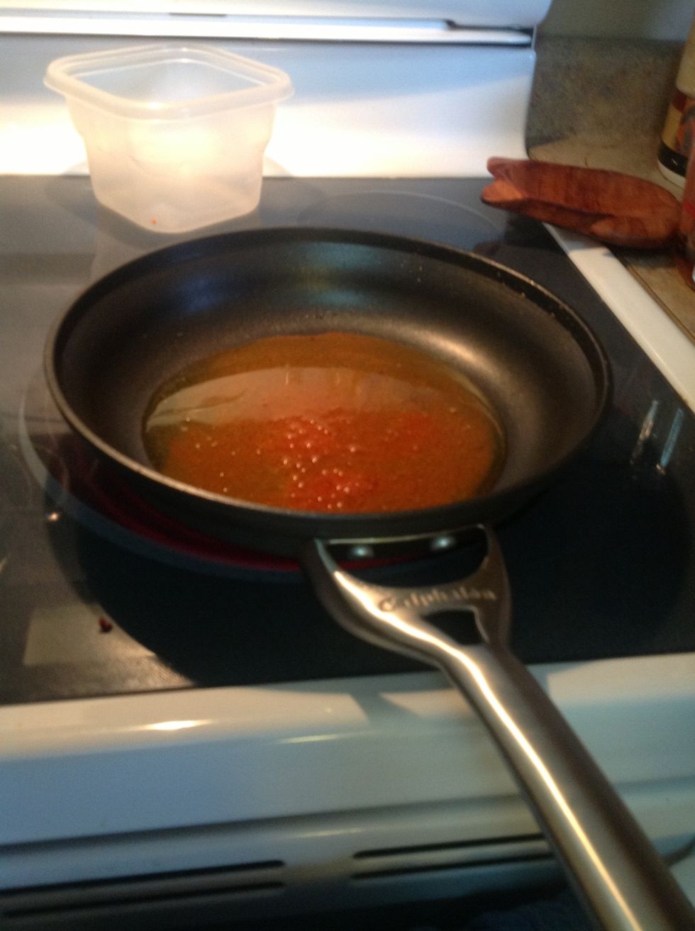 As the achiote melts it will give the oil it's color. This is the oil you will brown the chicken in.