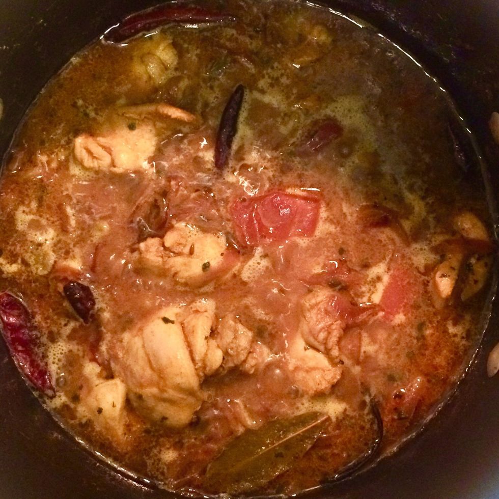 As the chicken starts to water, add a can of chicken broth. Cook over medium heat for 30 mins. until the mixture starts to thicken and the chicken is cooked well.