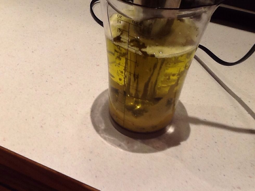 As the emulsification becomes obvious, turn the blender on leaving it at the bottom.