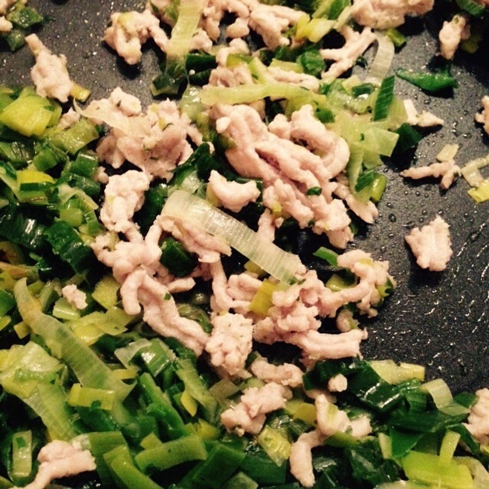 As the leek softens add the pork mince (or the sausage crumbled)
