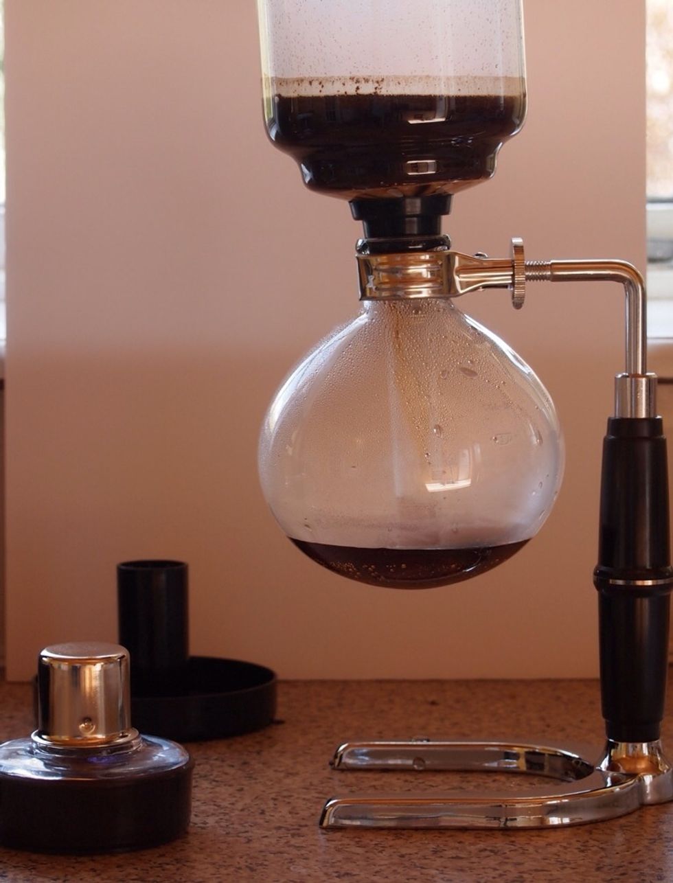 As the lower vessel cools I will draw the coffee back down the tube and the coffee grounds will be extracted by the filter.