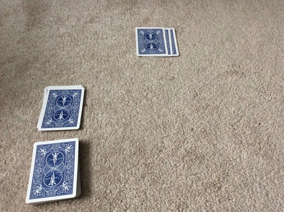 As the spectator is looking at their cards, make a pile of 10 cards