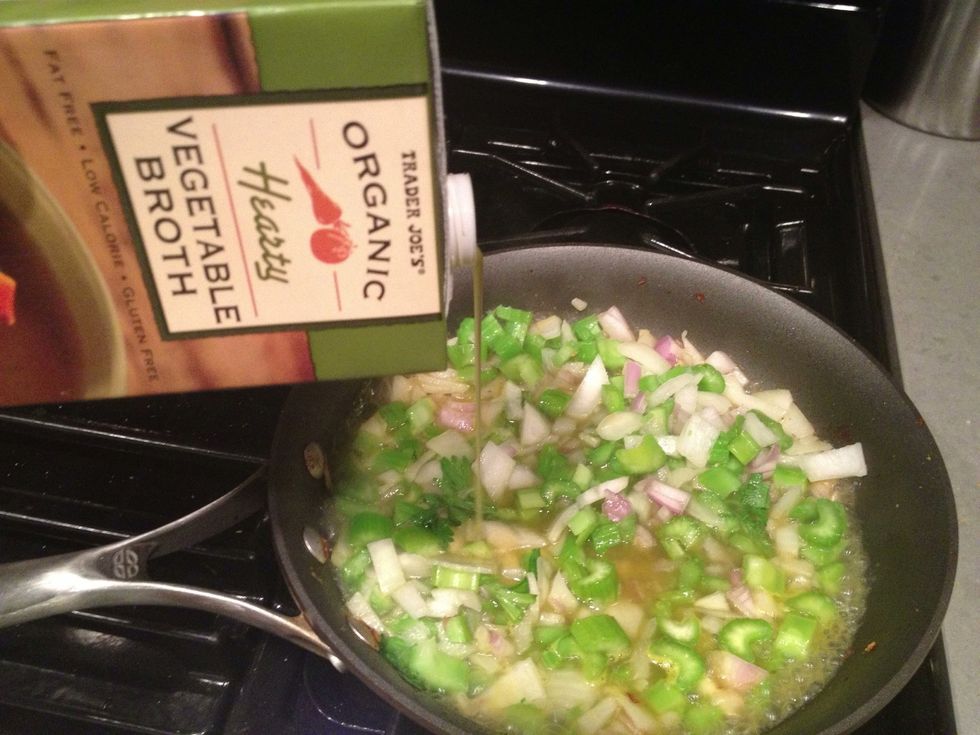 As the veggies begin to soften add liquid (I'm using vegetable broth today) to keep the mixture wet. Then the veggies can cook a bit more without browning.
