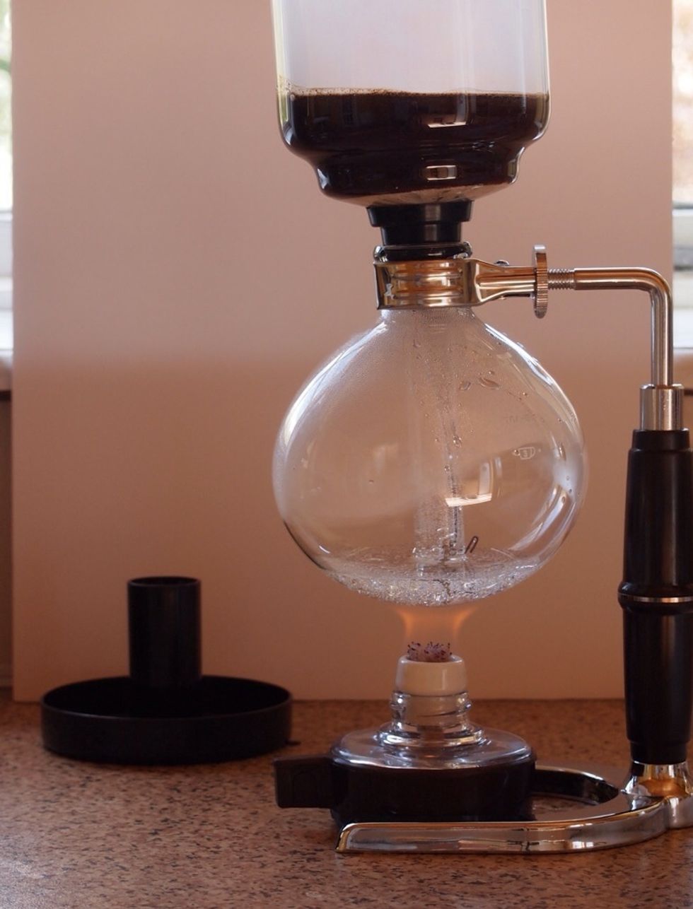 As the water is heated it will travel up the central tube to the ground coffee. As this happens give the grounds and water a stir.  As last water is sucked up there will be air introduced.