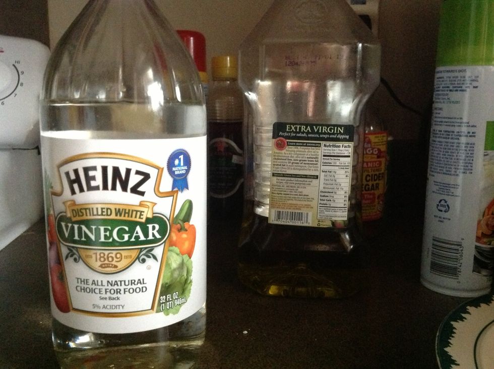 As the water starts to simmer go ahead and put in the white vinegar, it helps keep the egg together in the water.