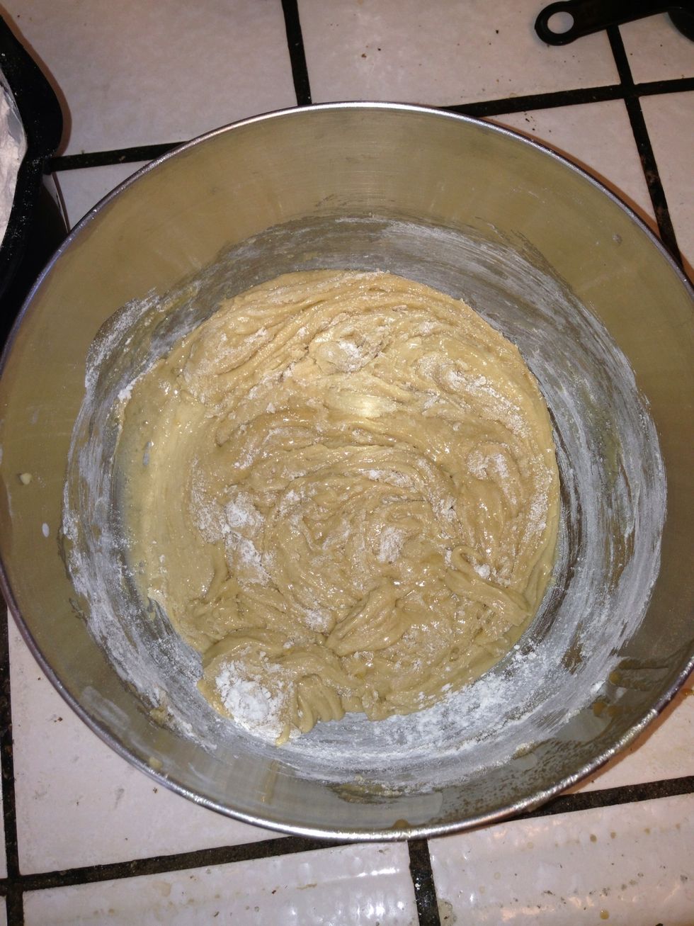 As you add the flour it should become less of a liquid and more of a solid