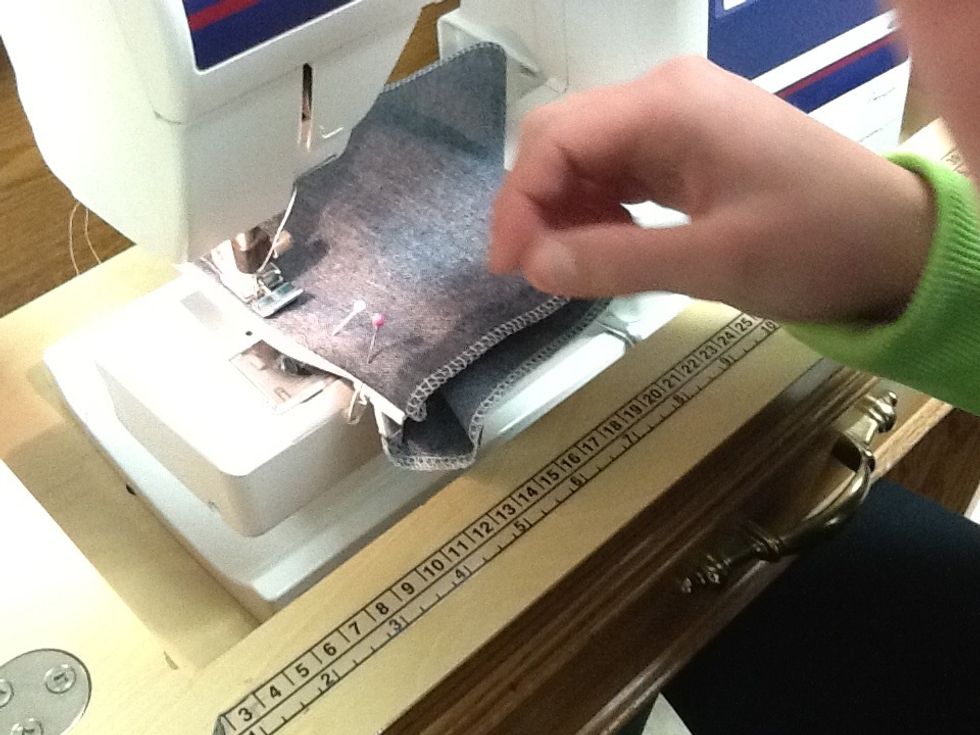 As you approach the bottom of the zipper, make sure fabric lays flat and no extra fabric is caught in on the under side.