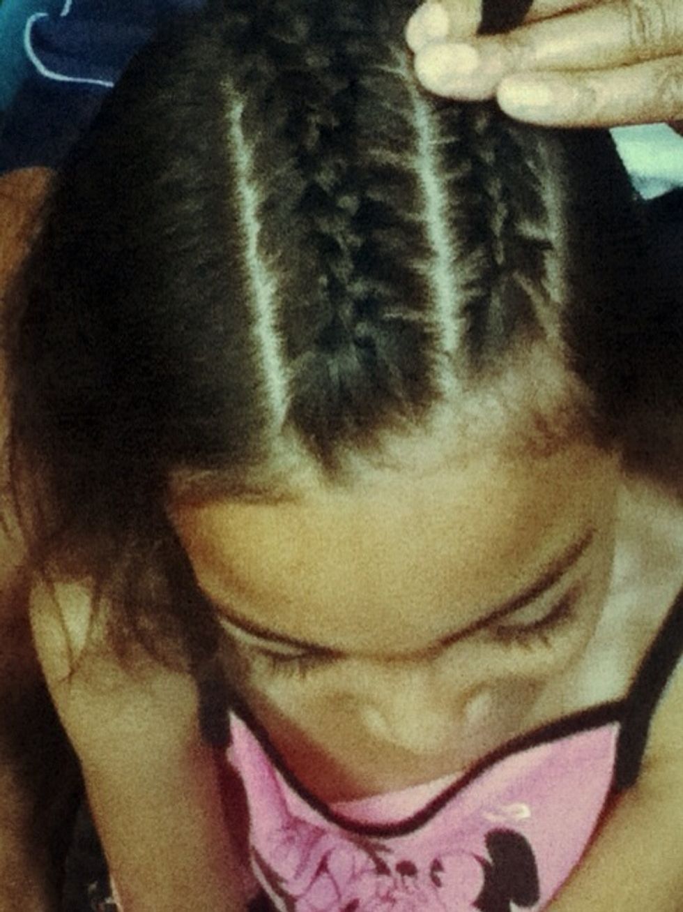 As you braid, you pick up tiny pieces of hair and make sure it's tight and stop at the half waypoint of your hair stop Do the the other half...