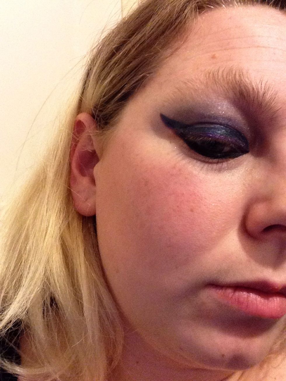 As you can see I have added more colour and darker shades, beginning to create the traditional smokey eyes look. I used silver/grey to highlight the lower brow at the top of the lid.