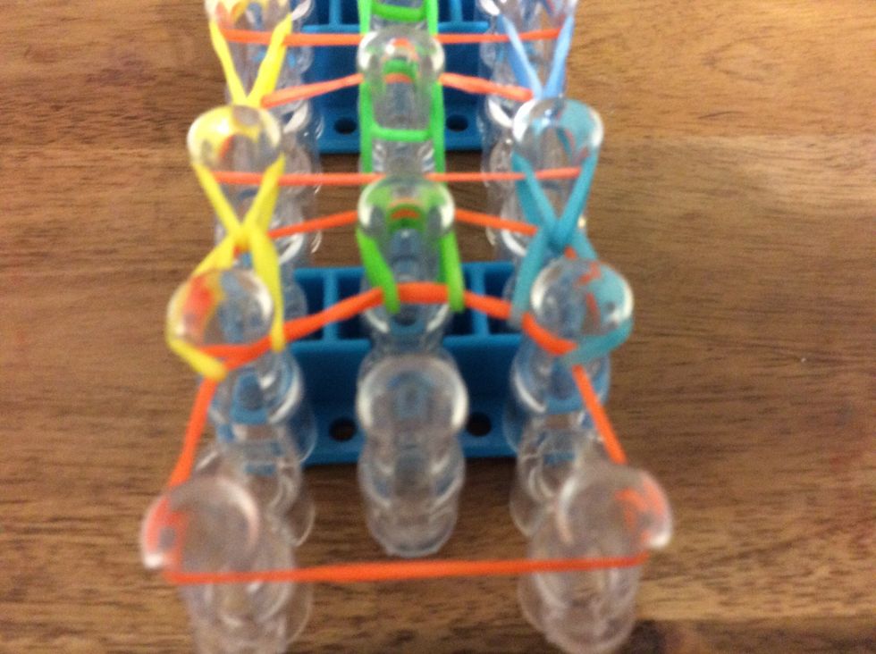 As you can see in the middle row you don't have to put the hook under the orange you just loop it