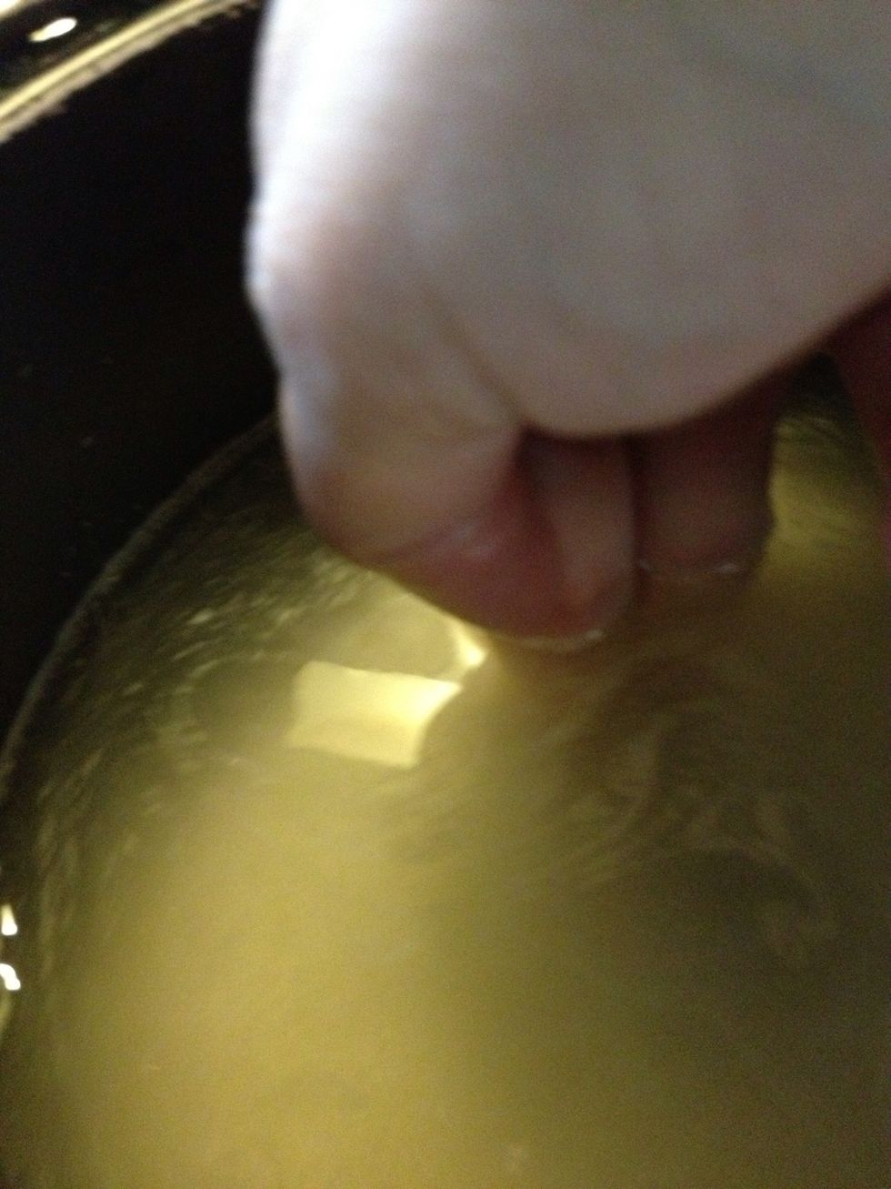 As you can see my finger has touched the bottom of the rice cooker. The water level is just right towards my second line