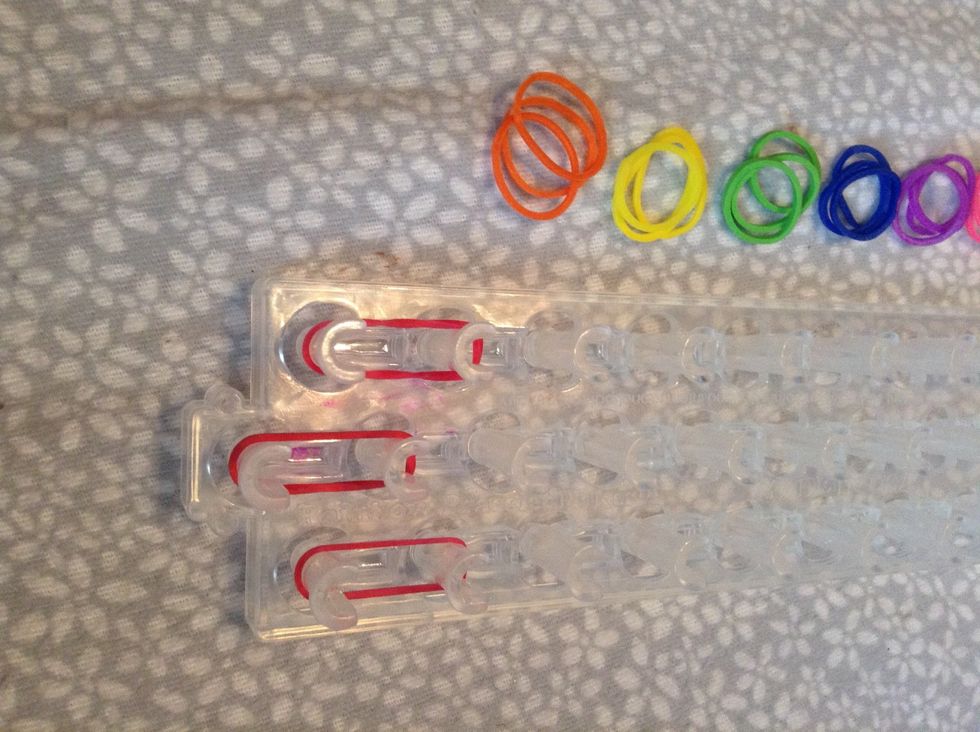 As you can see, you get each color and place the bands on the pins. Continue that until you make it to the top.