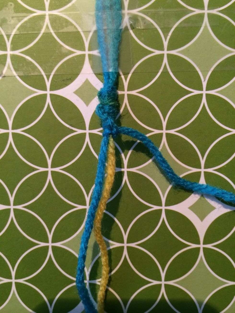 As you can see your staircase is going to wrap around the thread. When you get all the way to the right put your string under your bracelet to the left side