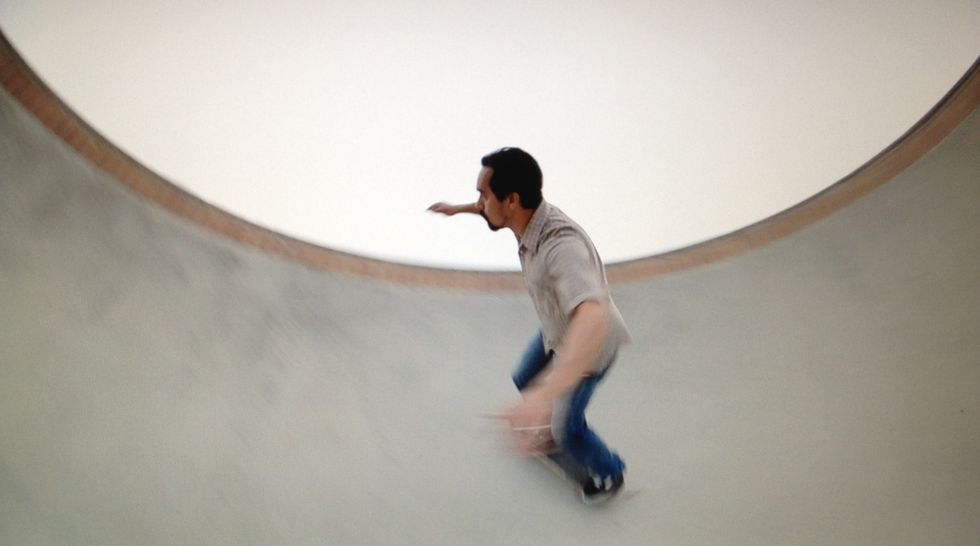 As you glide up the wall, start turning your forward shoulder toward the direction you are turning. Slightly lean your chest forward.