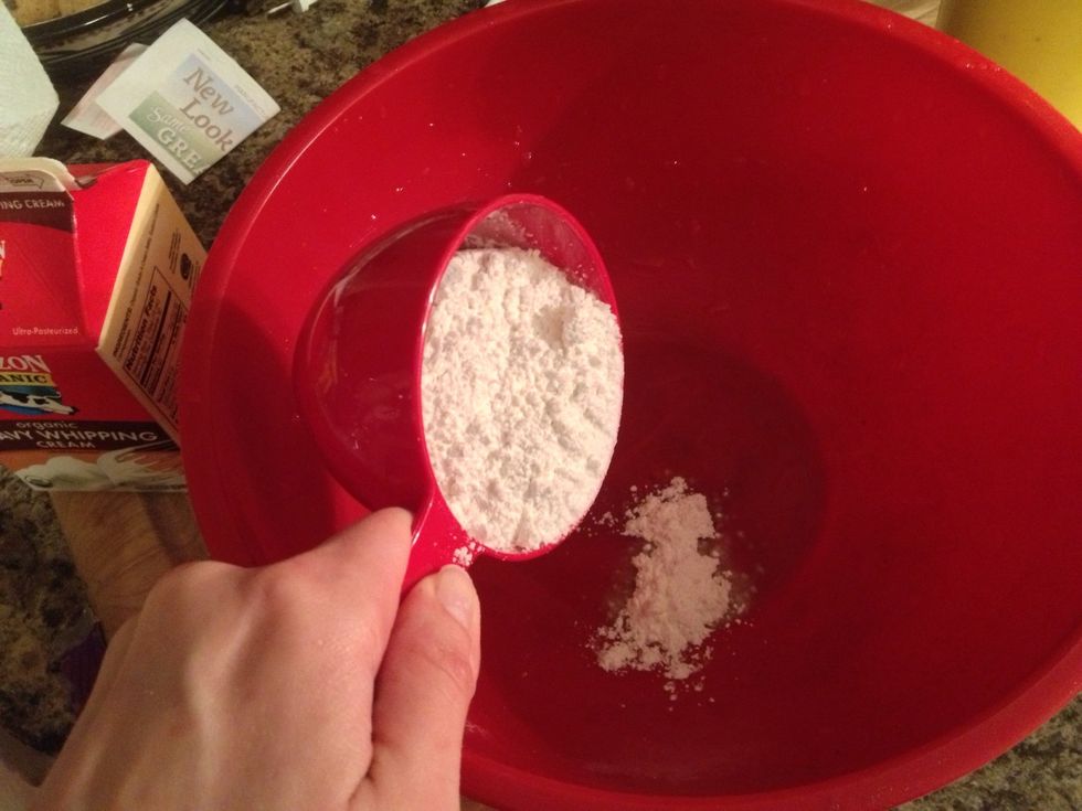 As you let the crust set, you can continue to finish the banana cream. Add about 3/4 cup of powdered sugar to a bowl.