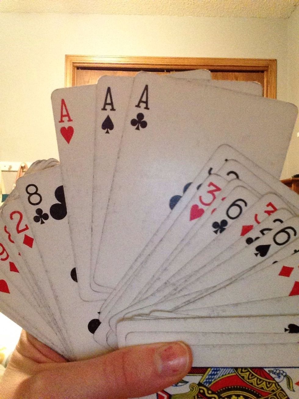 As you look through the deck, you will find that three aces are all right next to each other. HINT: They will be somewhere near the middle.