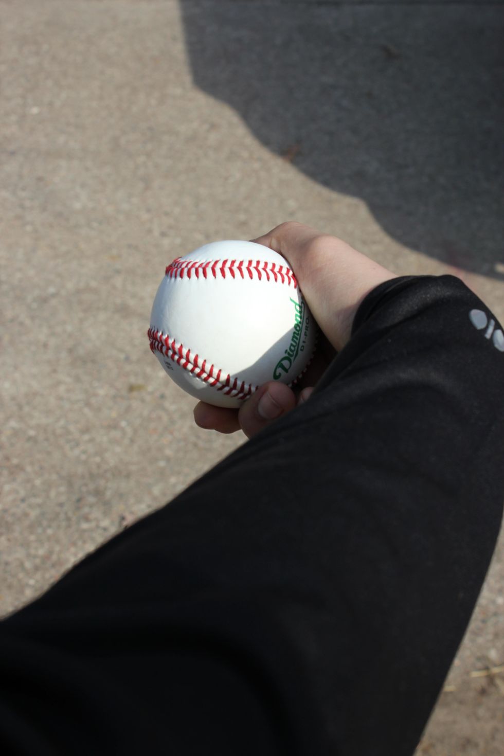 As you're releasing the ball, turn your wrist and your fingers forward like you're turning a doorknob.