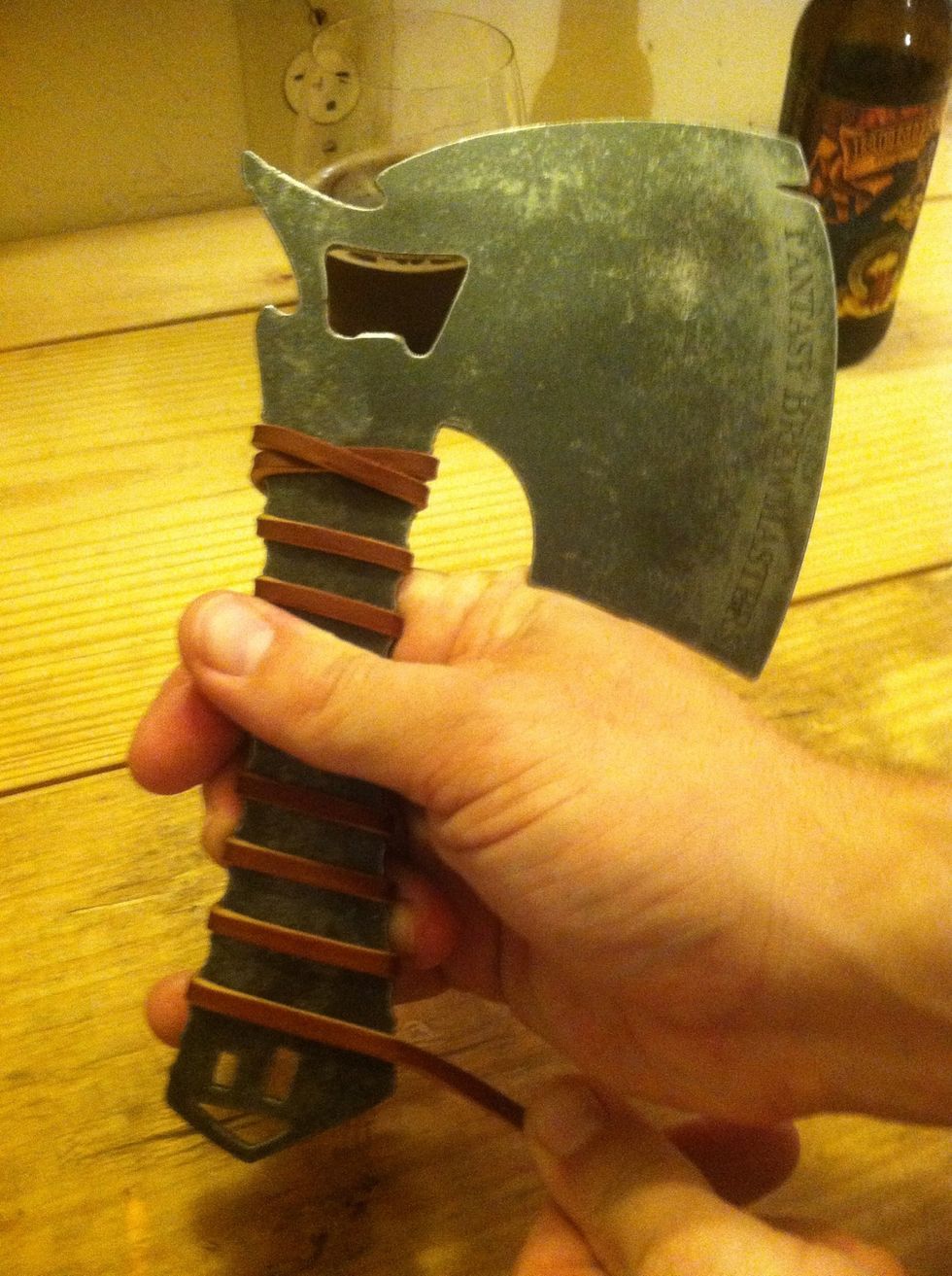 As you reach the bottom of the handle, flip the axe over so the blade is facing right. Now we stop wrapping when we reach the last notch on the right (blade side).