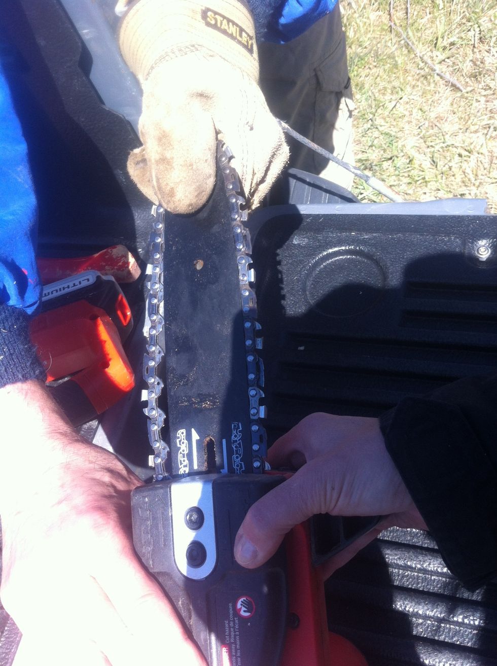 As you reinstall the housing, have a helper pull on the bar to keep tension on the chain. If you don't keep tension on the chain it will end up too loose and fall off again when you start cutting.