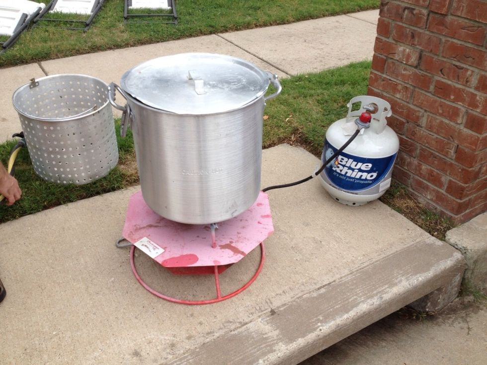 As you rinse the crawfish, begin to fill your pot with water just a bit less than 1/2 way. Bring your pot to the fire adding a big bag of seasoning, boil bag, crab boil liquid and a lot of lemons.