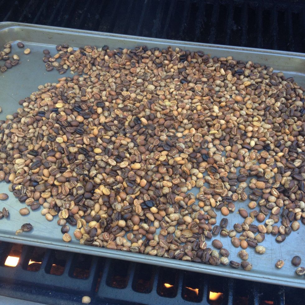 as you roast the beans will turn to a more dark color like so, you should be mixing them around and checking (the corners roast the fastest).