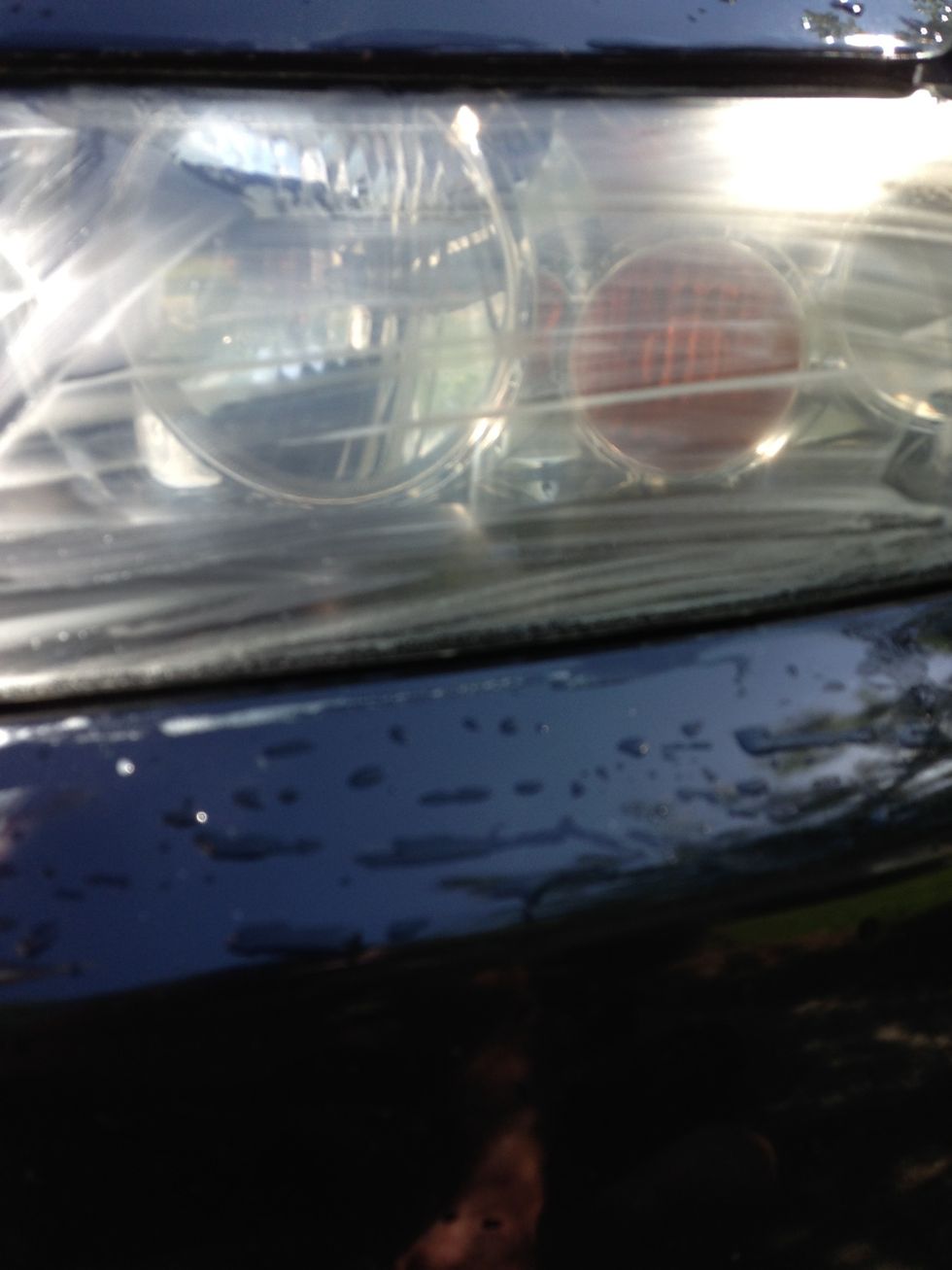 As you scrub, a film will become visible. This is essentially all the grime that you are sanding off.