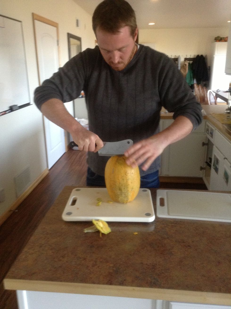Ask an  instructor to carefully cut the spaghetti squash in half long ways using a knife and cutting board.