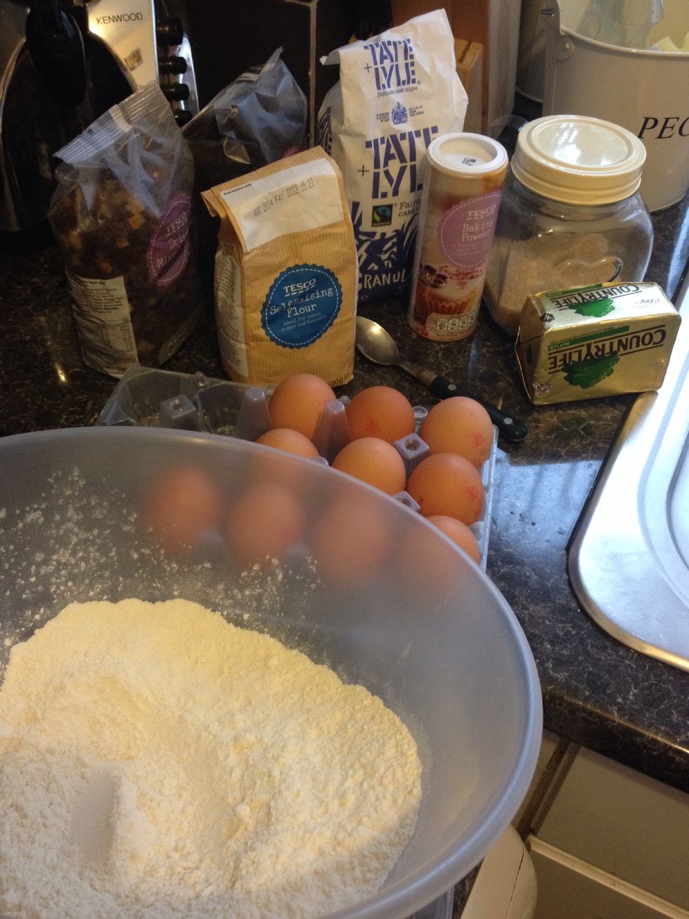 Assemble all ingredients. Put the oven to 200degrees C or gas mark 6... Sieve the flour and baking powder into a mixing bowl