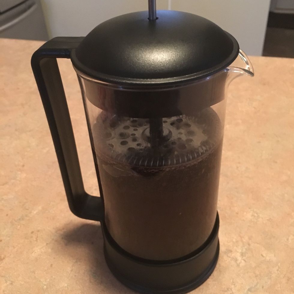 Assemble French press, carefully pushing to water level