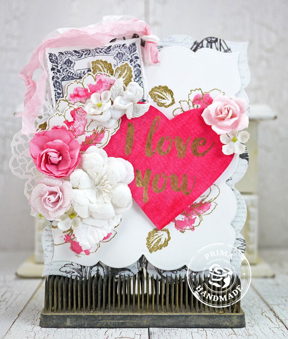 Assemble tag as shown creating layers and adding flowers, ribbon, and other embellies.