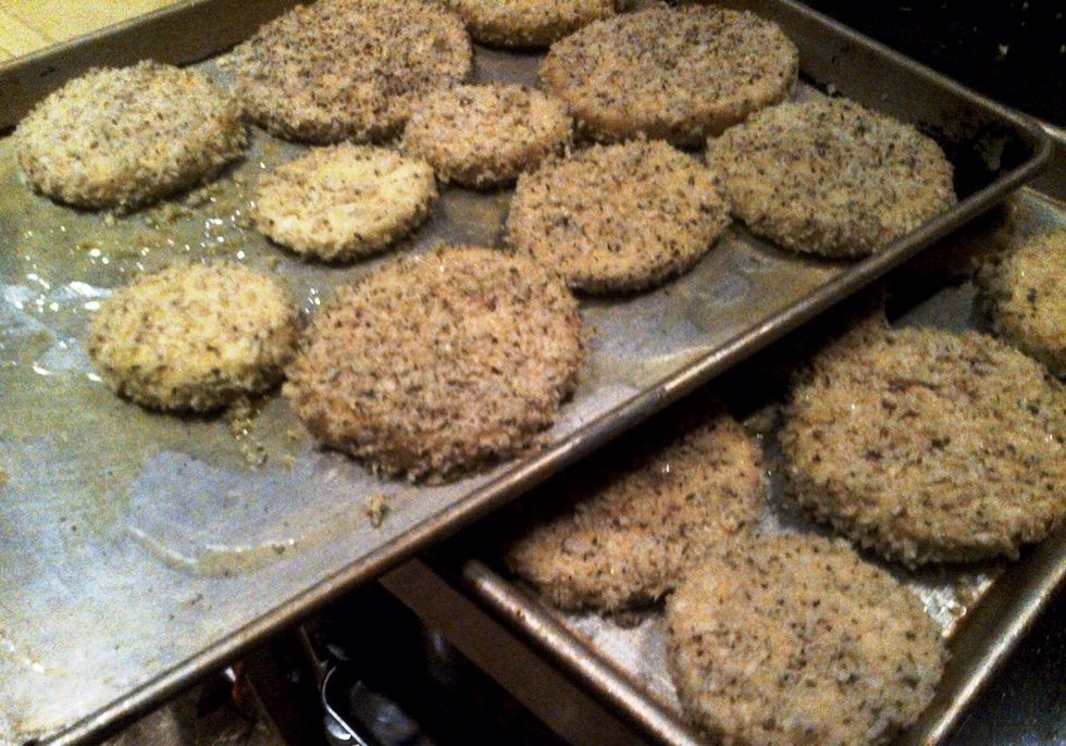 Assemble the breaded eggplant onto the sheet pans.