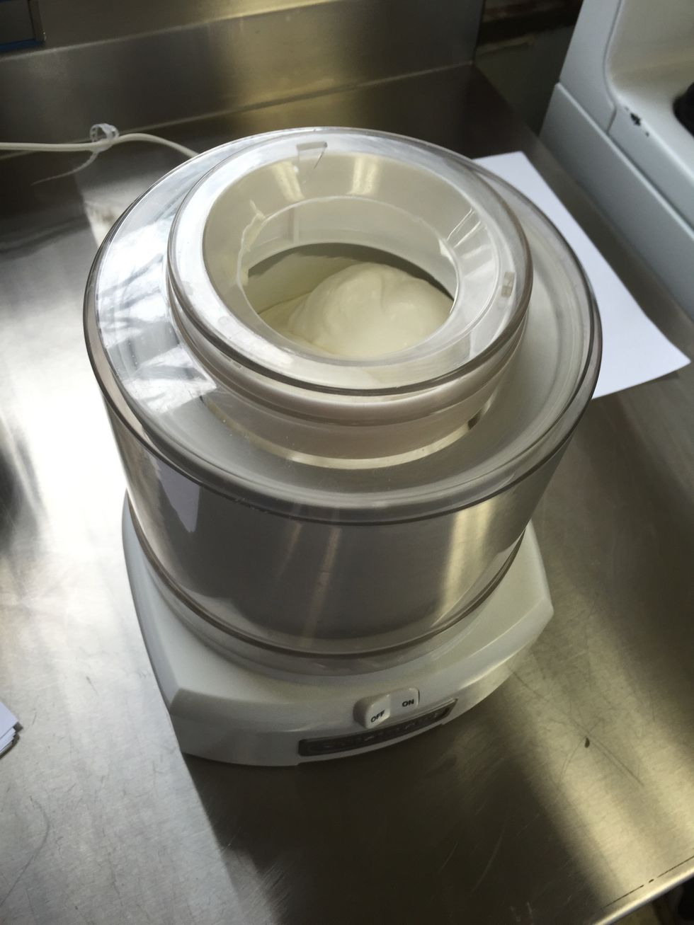 Assemble the ice cream maker according to its directions and start it. Slowly pour the ice cream mixture into the maker, and mix until desired thickness.