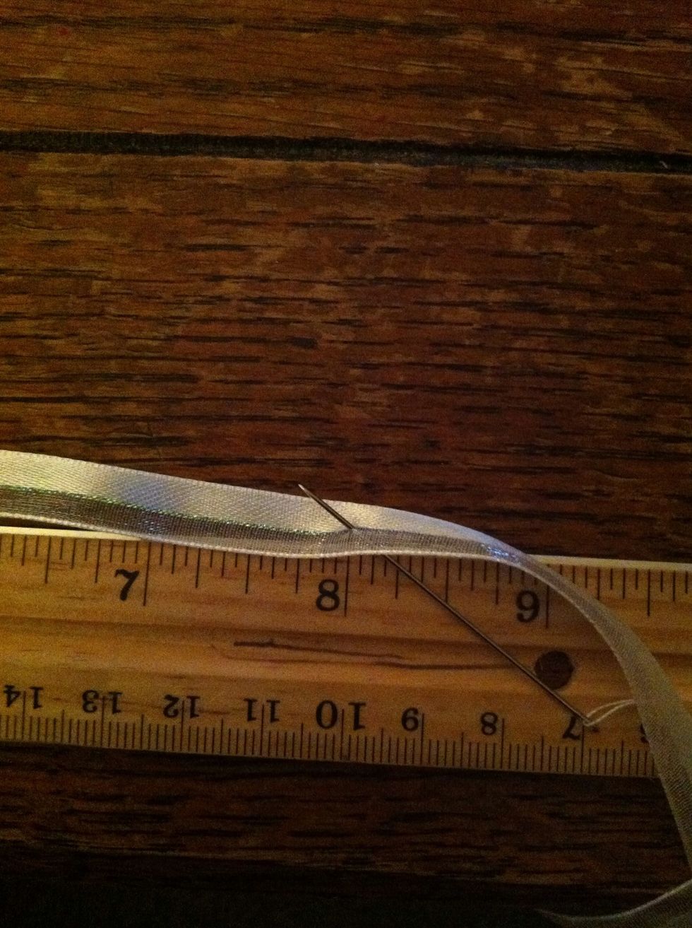 At about 8in, insert your needle through your ribbon. Use as thin of a needle as possible, this one is far too thick but you couldn't see my other one well in the pictures.