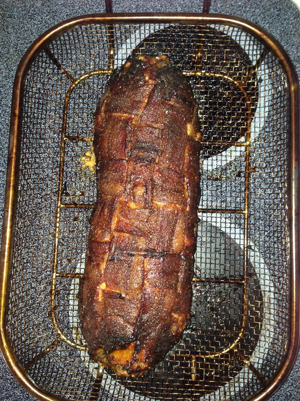 At approximately 3 hours total the thermometer alarm went off and it was done.   I double wrapped it into foil to bring to dinner.