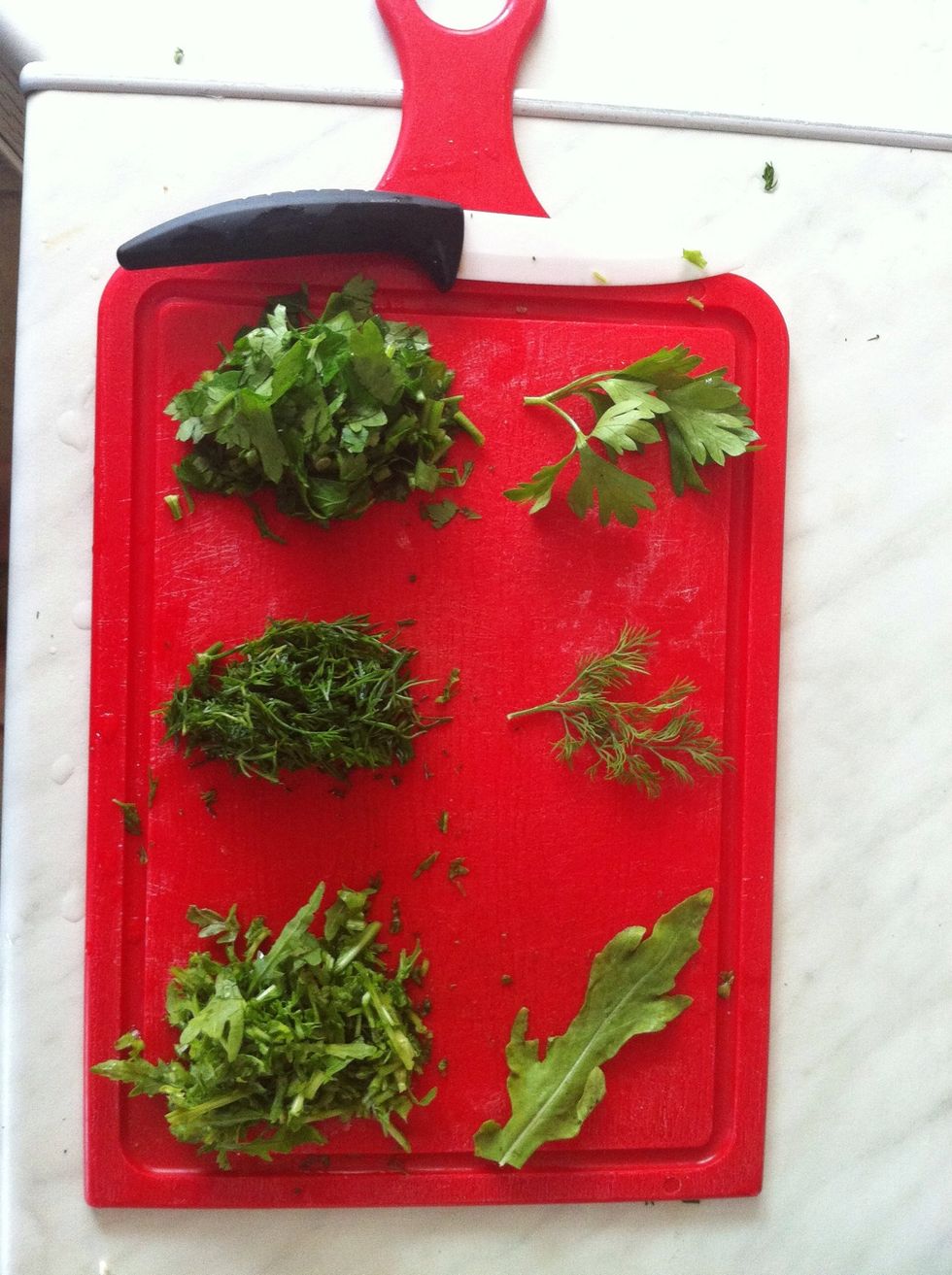 At first clean under the water some herbs and then finely chop them. As you see I used three herbs: parsley, fennel and arugula (but it can be anything you like and want)