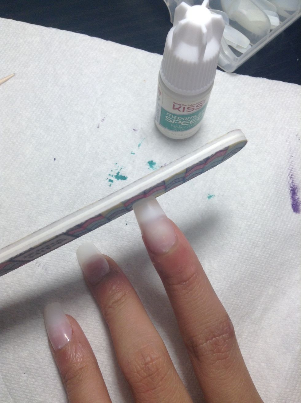 At the end of each nail there is this little thing so file it off or cut it off with your nail clipper.