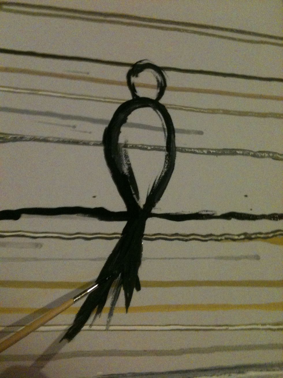 At the end of one canvas, paint a small circle and larger pointed oval underneath. Paint long black strokes and the end of the oval to make the tale feathers.