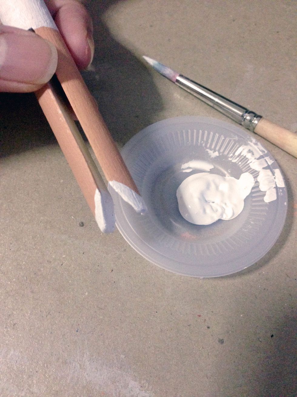 At the end of the peg, paint the shoes as shown...