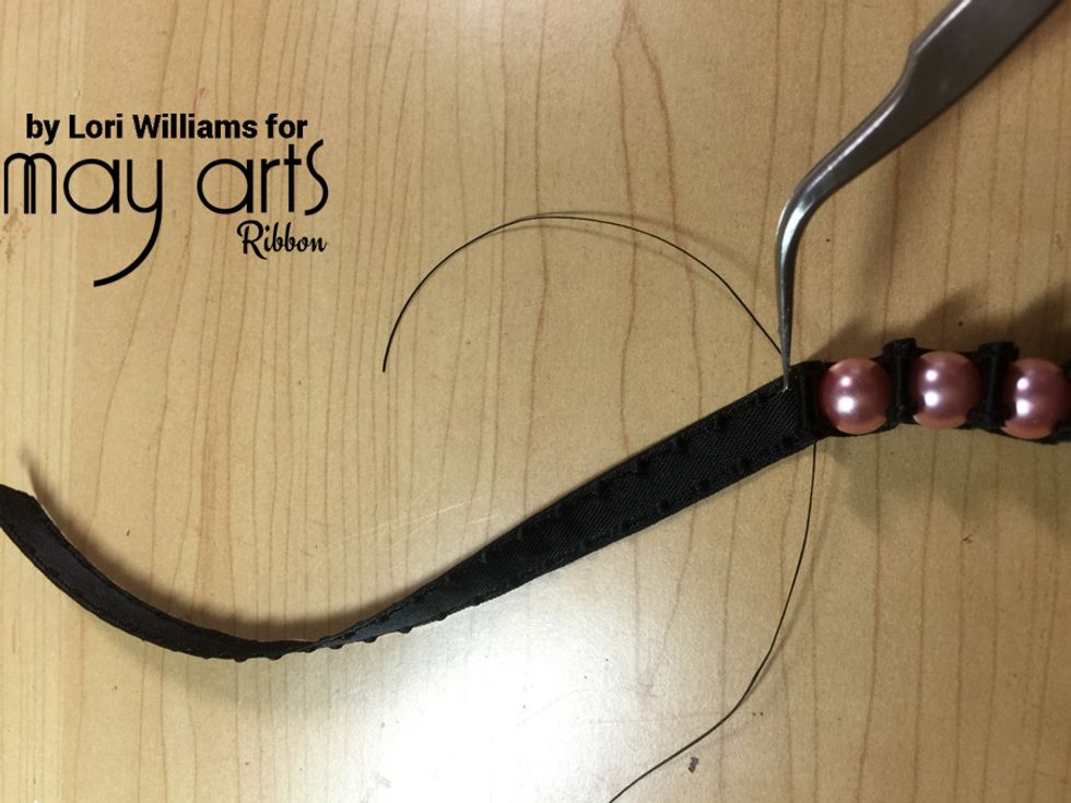 At the end of your bracelet when you\u2019ve run the thread back through tie a double knot and then run the loose ends back through the three or four of the pearls to finish off.