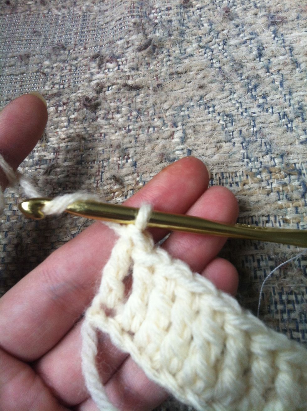 at the end of your row you need to chain 4 for your turning chain. yarn around and pull trough the loop on your hook (4 times)