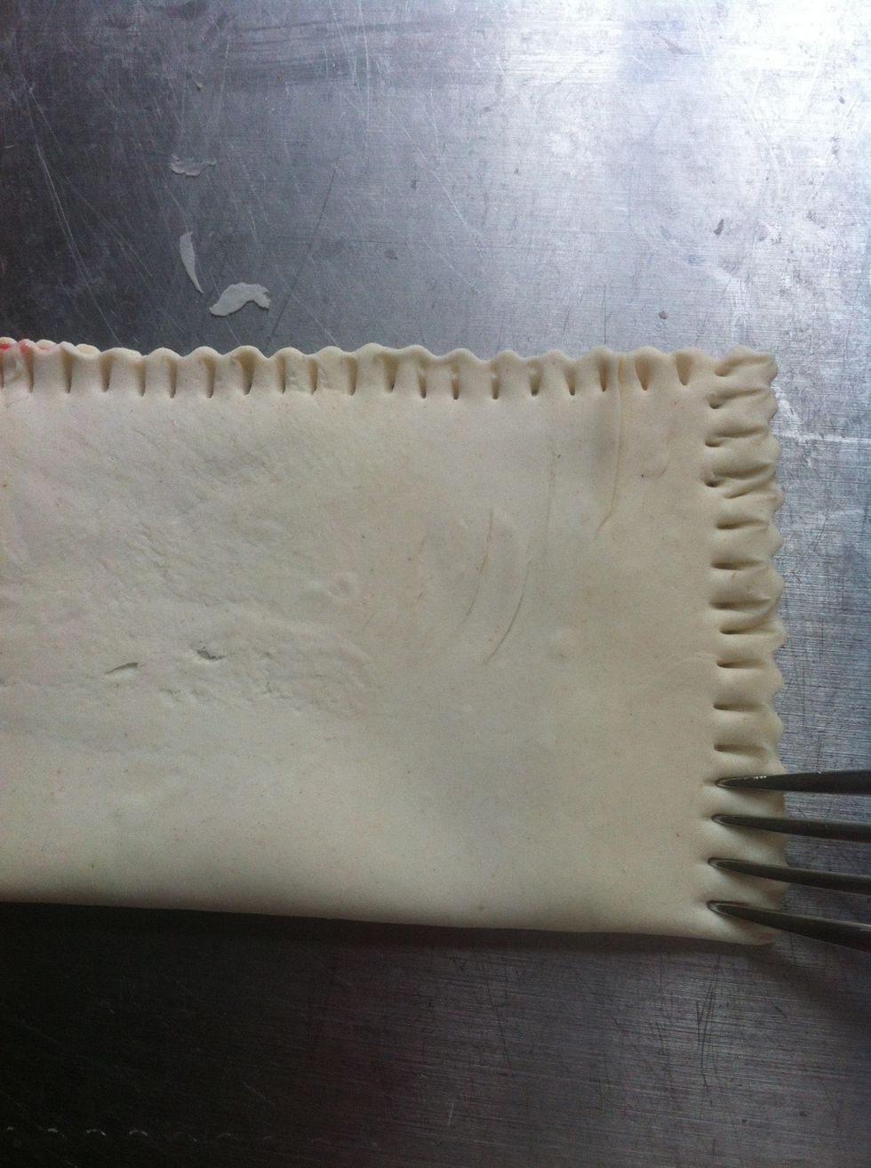 At the end, press a fork against the puff pastery to close it.
