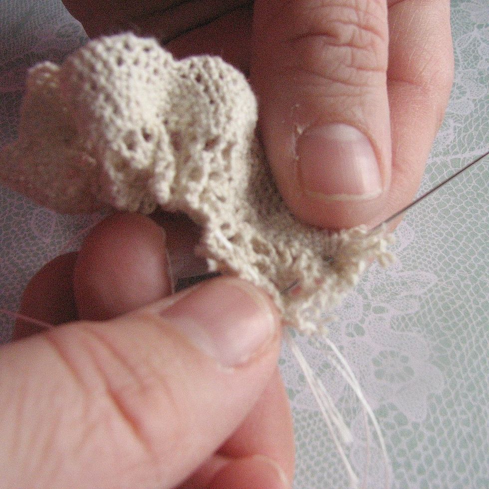 At the end pull thread to create ruffle and sew ends together. Continue stitch width of lace to completely make a circle.