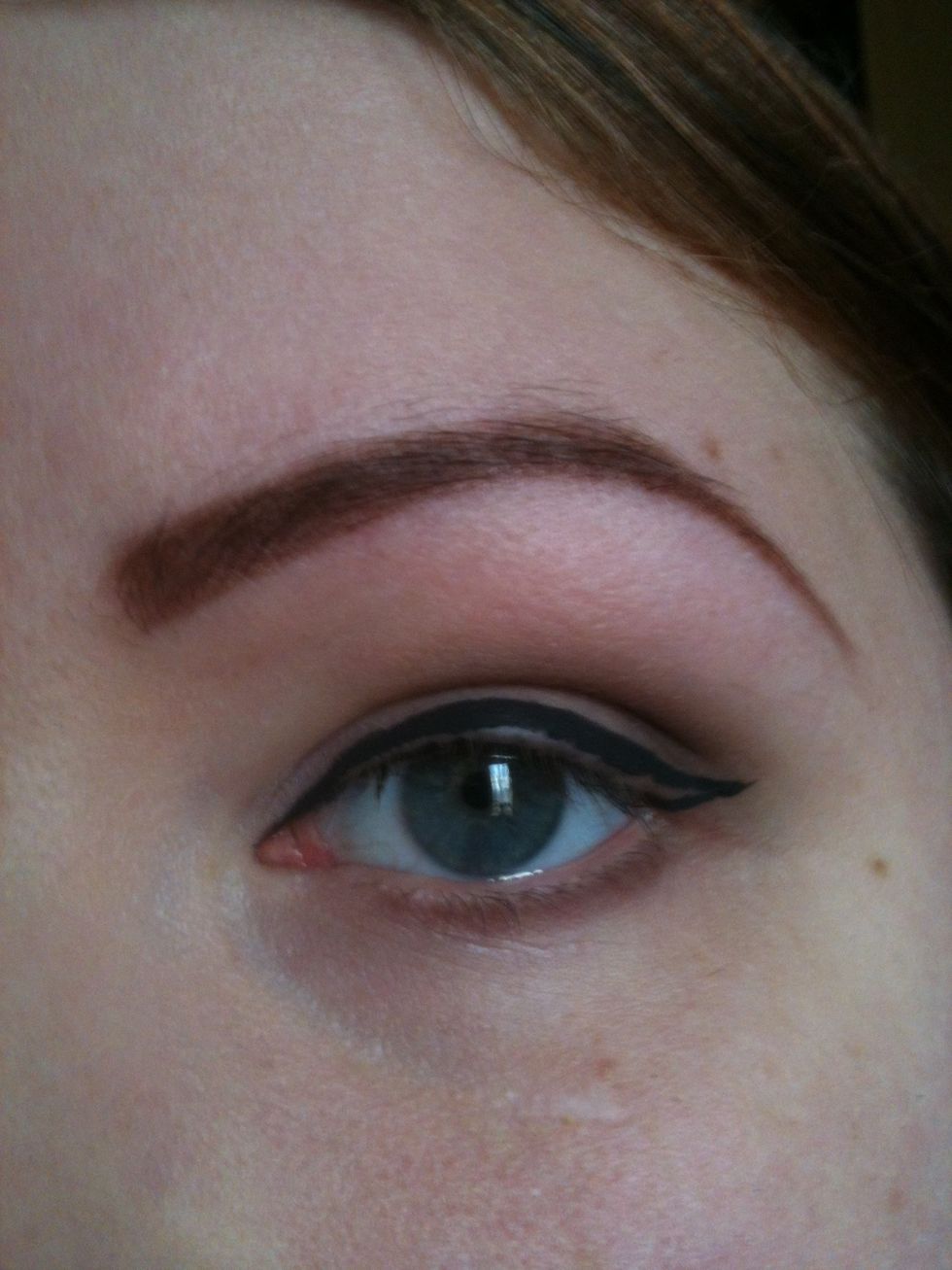 At the inner corner of your eye draw the top of your line, then follow it along in the middle and join it to the flick. You can do that in one or two parts.