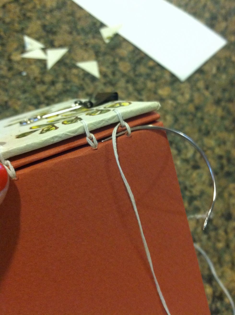 At the last station do go back to through the same hole so loop around herself to make the bond strong