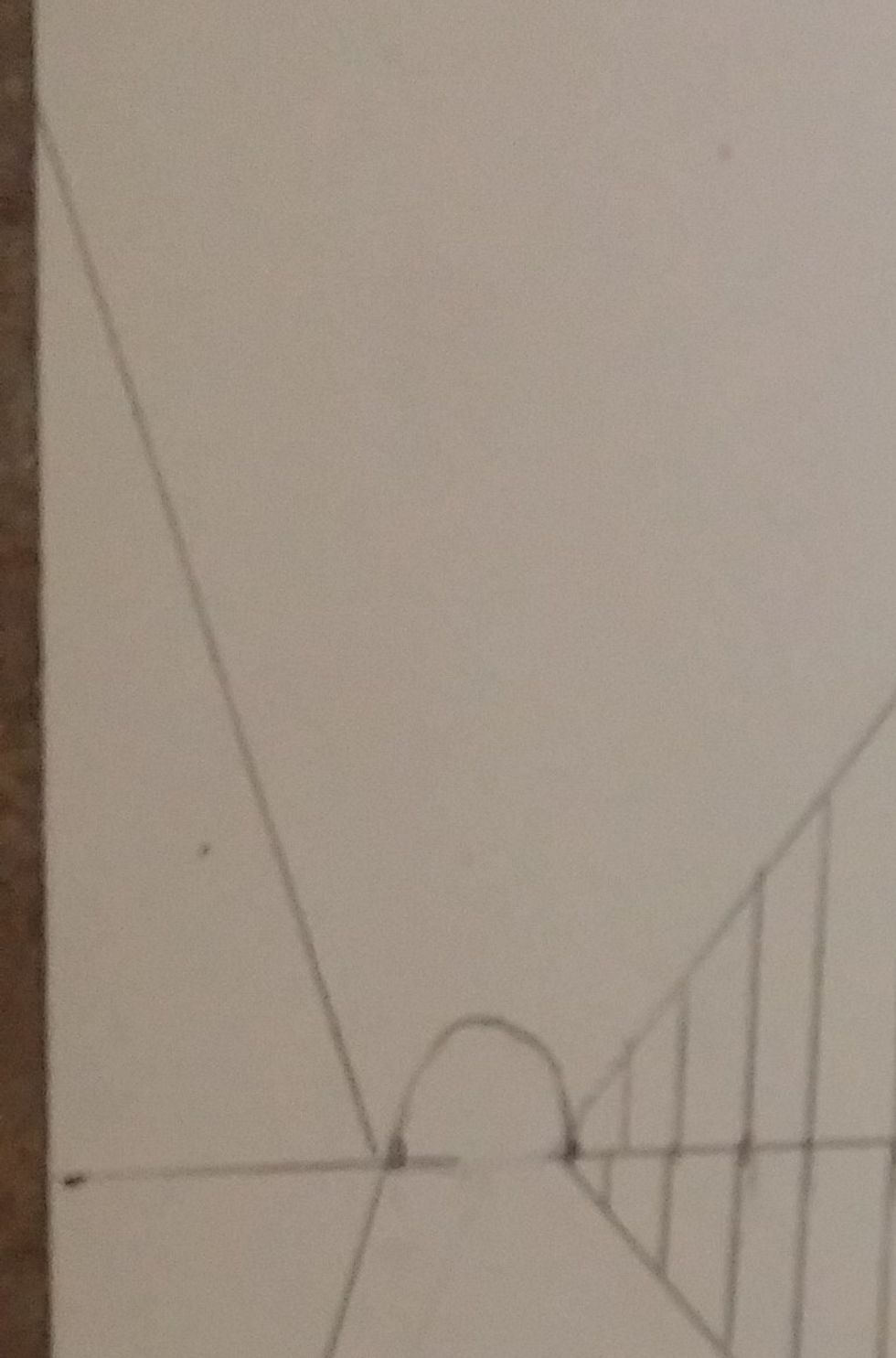 At the outside vanishing points add another diagonal line going to the edge of the paper, to about the same height as the middle diamond. This will create half a diamond. Do this to both sides.