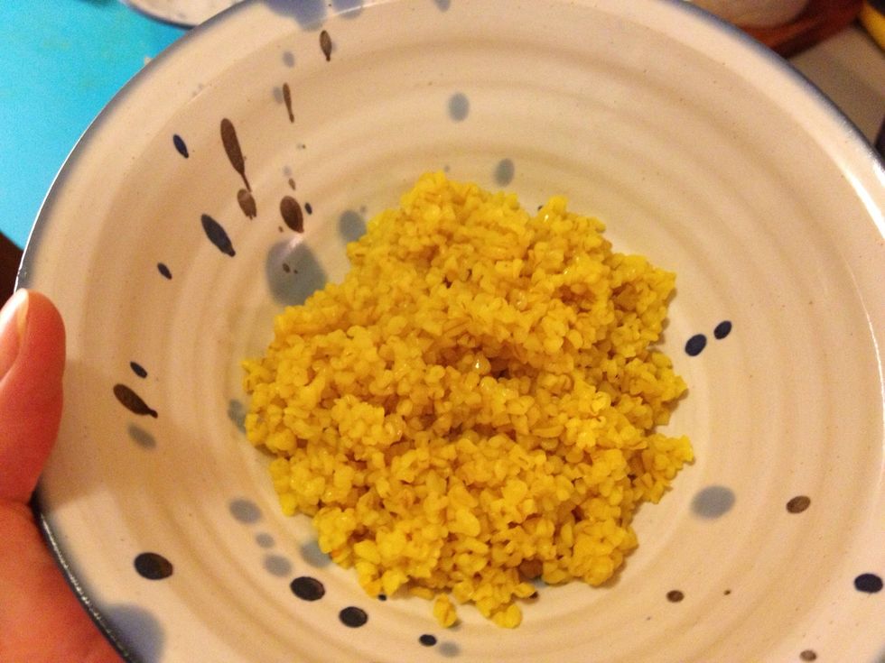 At the same time as you add the carrots also boil some water for the bulgur. I added turmeric powder to give the dish some extra color. When ready to serve, scope the bulgur onto a plate.